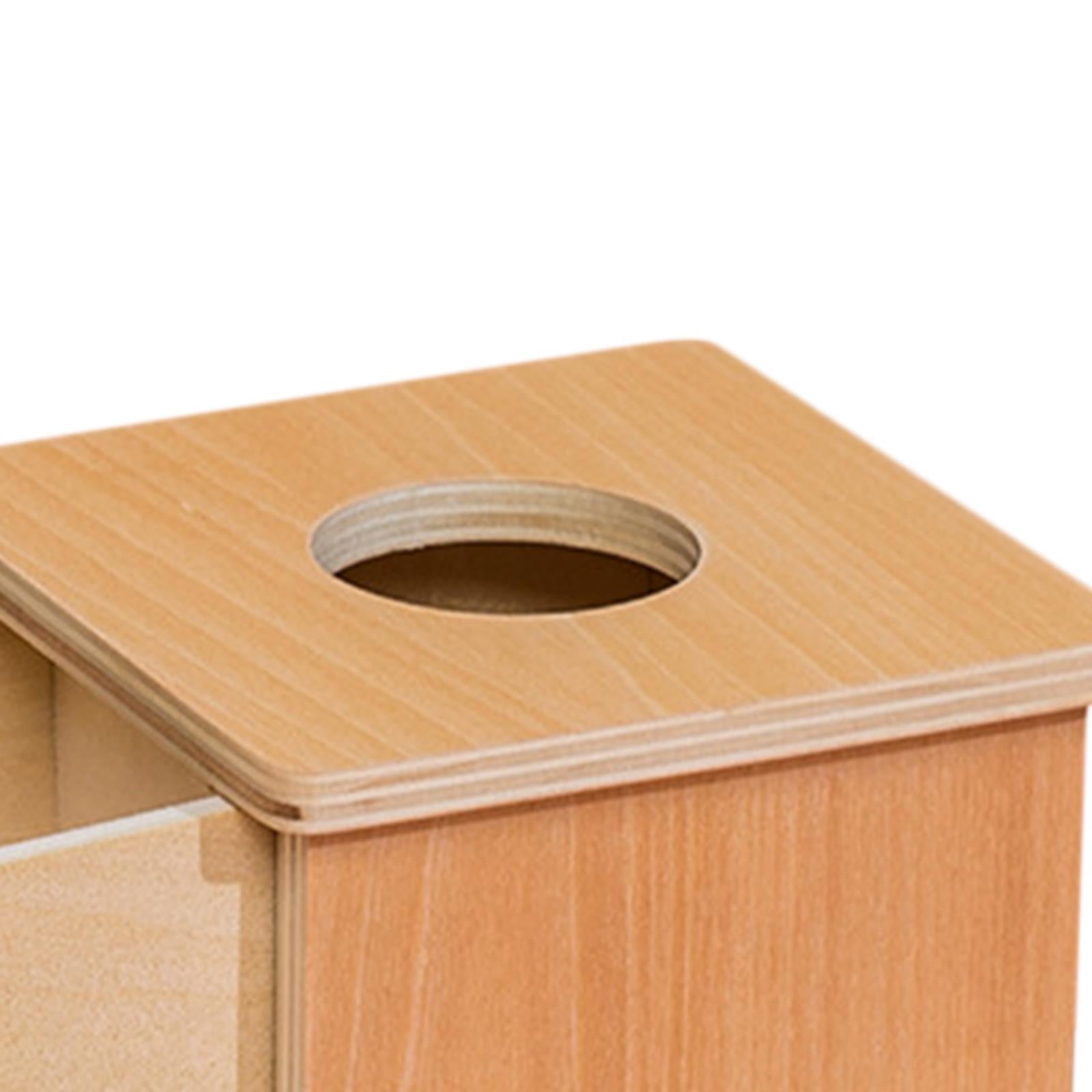 Top, circular slot on wooden object permanence box